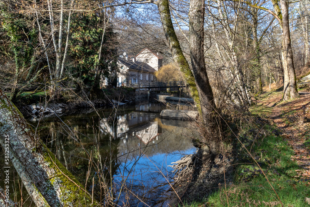 A house on the bank of the river Sedelle in Creuse, France.