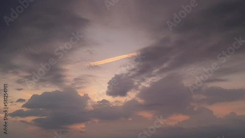 Time lapse of Majestic sunset or sunrise over sea landscape,Amazing light of nature cloudscape sky and Clouds moving away rolling, Colorful sunset light dramatic clouds in golden hour Footage photo