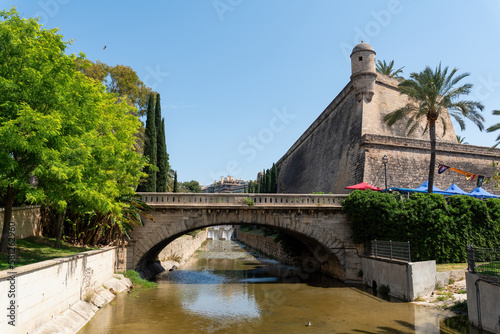 Ancient walls of the fortress Bastio de Sant Pere, Torrent de Sa Riera and Pont de la Riera - Palma de Mallorca, Spain