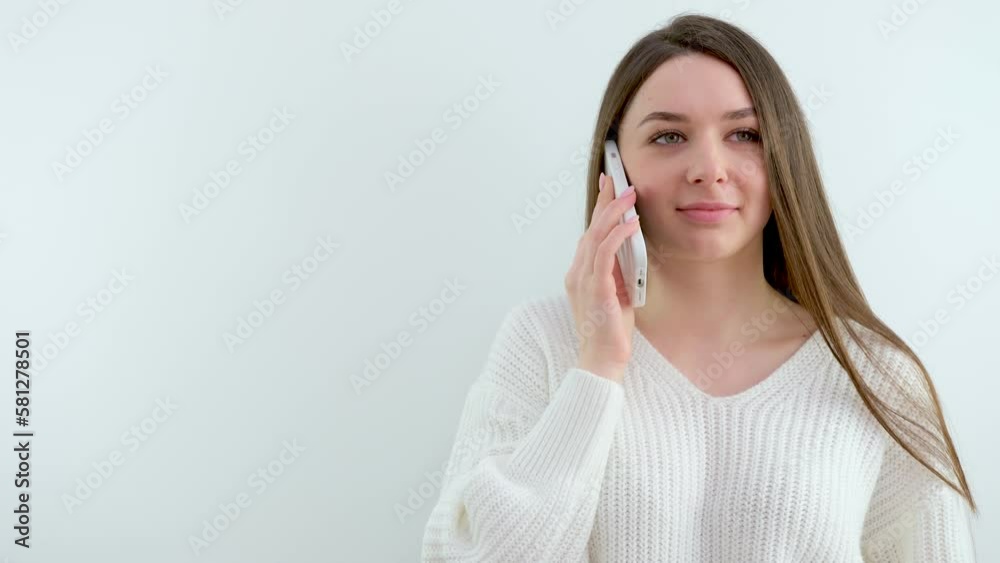 Young german woman in a white shirt Upset sad casual woman in white shirt talking on phone. High quality 4k footage Young german woman in a white shirt Upset sad casual woman in white shirt talking on phone. High quality 4k footage