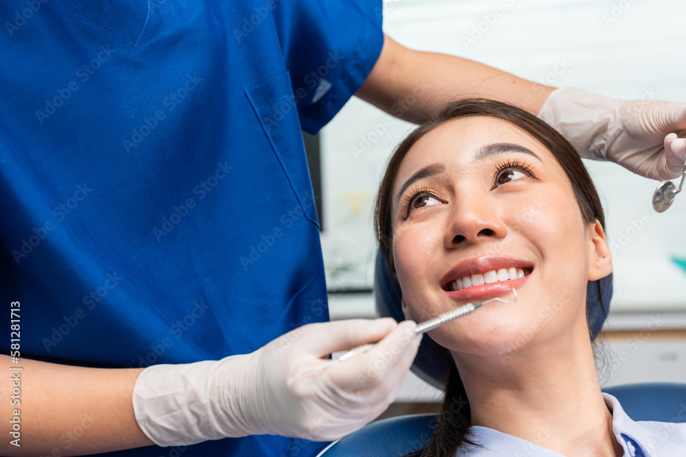 Caucasian dentist examine tooth for young girl at dental health clinic. Caucasian dentist examine tooth for young girl at dental health clinic.