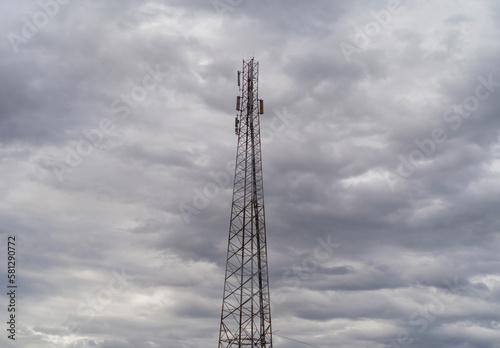 TV radio antenna network telecom tower isolated on sky. Station