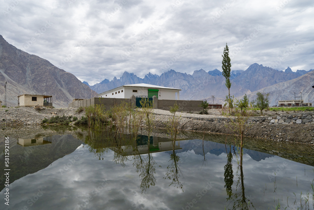 A pond river lake in Karakoram high mountain hills. Nature landscape background, Skardu-Gilgit, Pakistan. Travel on holiday vacation.