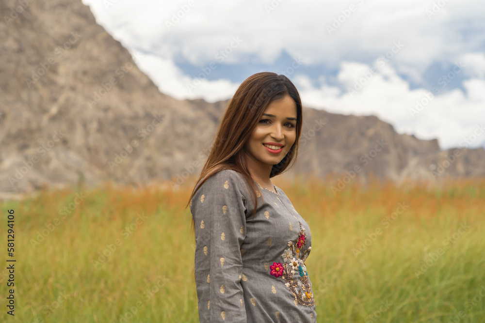 A Pakistani woman tourist travel in Karakoram high mountain hills. Nature landscape background, Skardu-Gilgit, Pakistan. Travel on holiday vacation. People lifestyle. A Pakistani woman tourist travel in Karakoram high mountain hills. Nature landscape background, Skardu-Gilgit, Pakistan. Travel on holiday vacation. People lifestyle.