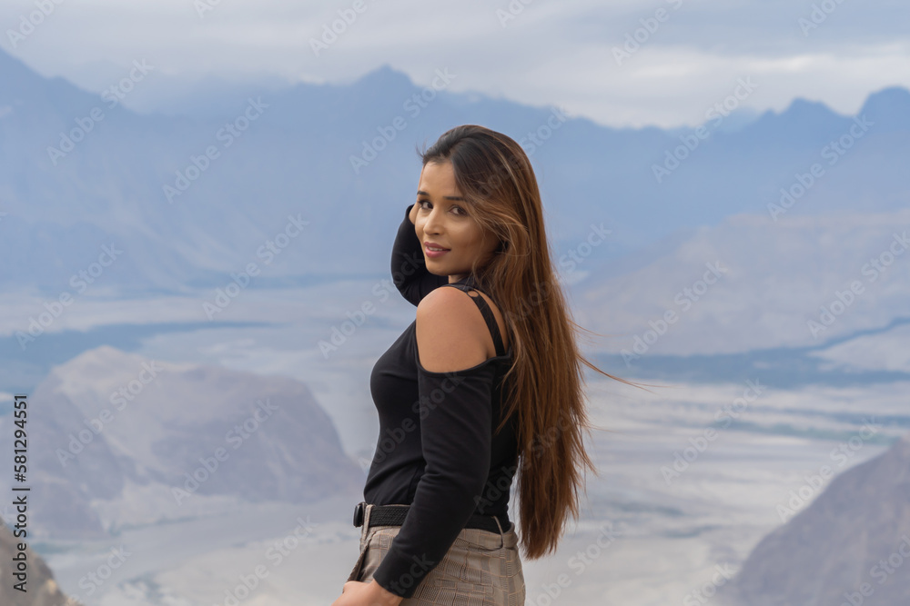 A Pakistani woman tourist travel in Karakoram high mountain hills. Nature landscape background, Skardu-Gilgit, Pakistan. Travel on holiday vacation. People lifestyle. A Pakistani woman tourist travel in Karakoram high mountain hills. Nature landscape background, Skardu-Gilgit, Pakistan. Travel on holiday vacation. People lifestyle.