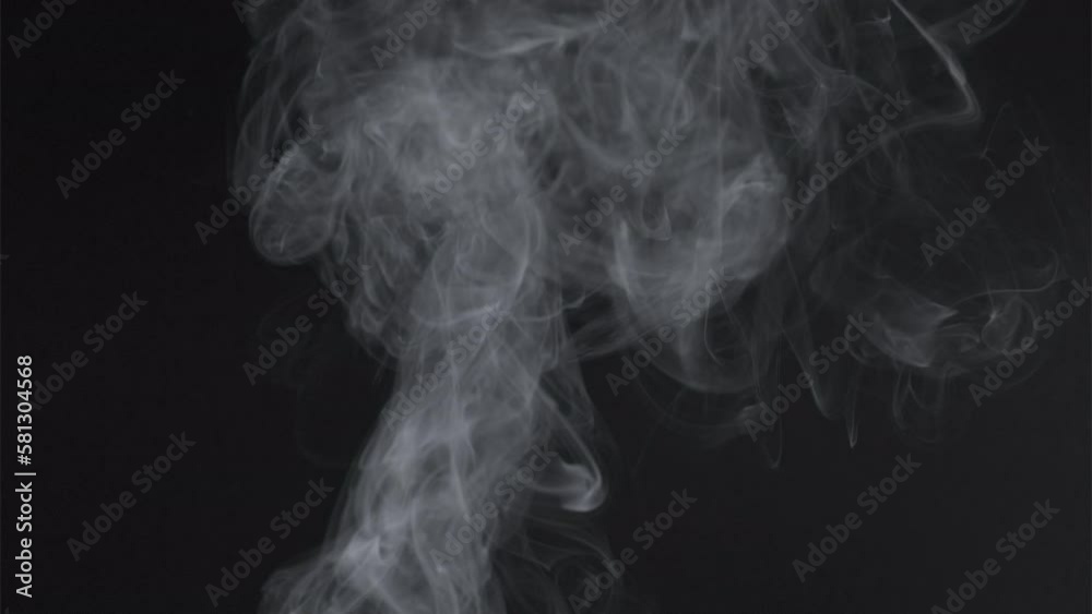 Slow motion of white smoke, fog, mist, vapor on a black background. Slow motion of white smoke, fog, mist, vapor on a black background.