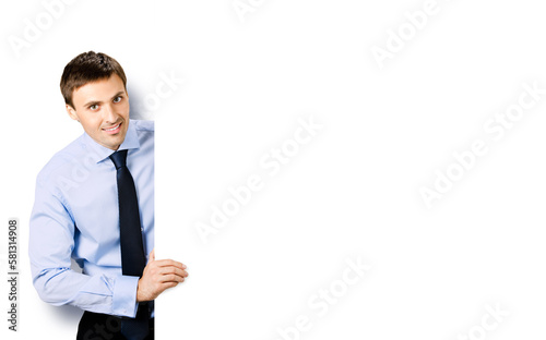 Portrait image of business man professional bank manager in confident cloth, necktie stand behind show empty white banner signboard billboard with copy space area. Isolated against white background.