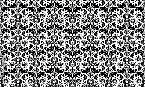 Wallpaper in the style of Baroque. Seamless vector background. White and black floral ornament. Graphic pattern for fabric, wallpaper, packaging. Ornate Damask flower ornament