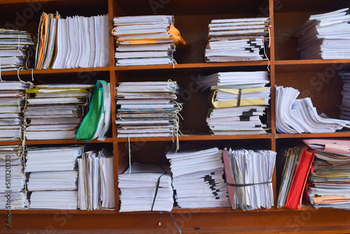 pile of books on the shelf