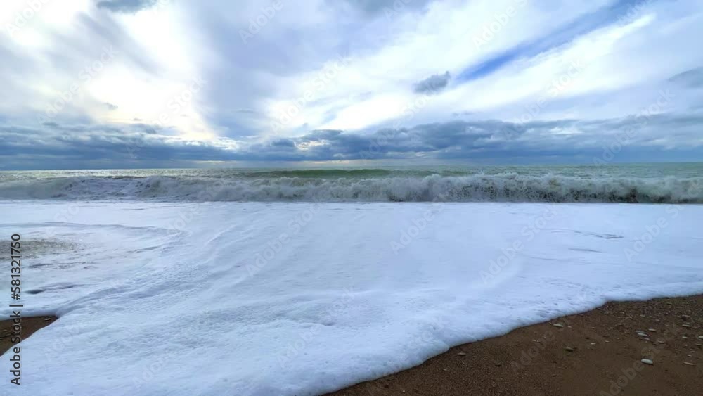 Powerful sea waves are crashing on the Black Sea coast. Waves splash on the beach with pebbles during a storm. Storm at sea. Panoramic view of the Black Sea. Russia. Sunset on the beach. 4K Powerful sea waves are crashing on the Black Sea coast. Waves splash on the beach with pebbles during a storm. Storm at sea. Panoramic view of the Black Sea. Russia. Sunset on the beach. 4K