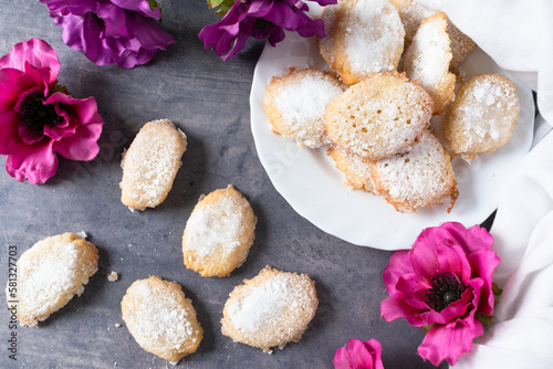 Siena Ricciarelli on a dark table, a traditional Italian dessert with almond flour and egg white.