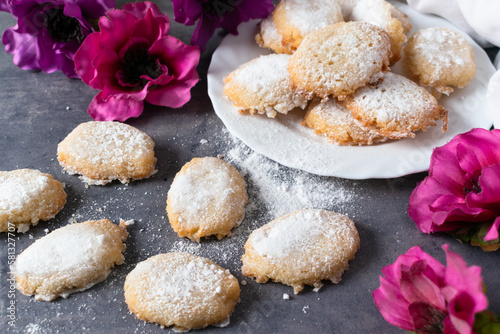Siena Ricciarelli on a dark table, a traditional Italian dessert with almond flour and egg white.