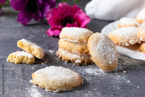 Siena Ricciarelli on a dark table, a traditional Italian dessert with almond flour and egg white.