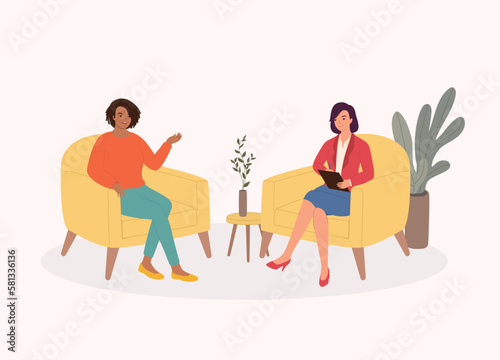 Smiling Black Female Client Talking To Her Psychologist Who Is Listening While Taking Notes During The Consultation Session. Psychology. Psychotherapy. Psychiatric. Counselee. Psychiatrist.