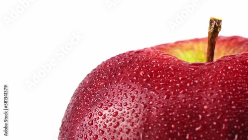 Close-up of a Juicy Red Apple with Water Droplets on a White Background