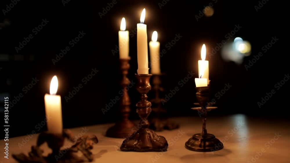 Candlelight on a dark festive background Candlelight on a dark festive background