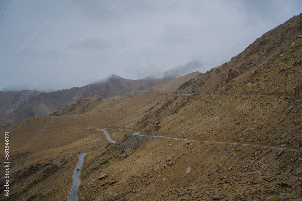 Beautiful view of Khardung La Pass- Leh road on the high mountain covered with snow. It is the highest pass in the world that motorbikes can run through at Ladakh, Leh, India