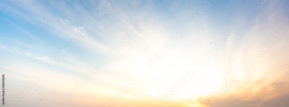 Fototapeta premium sky panorama Natural colors Evening sky Shine new day for Heaven,The light from heaven from the sky is a mystery, In twilight golden atmosphere,Modern sheet structure design New Year 2023 
