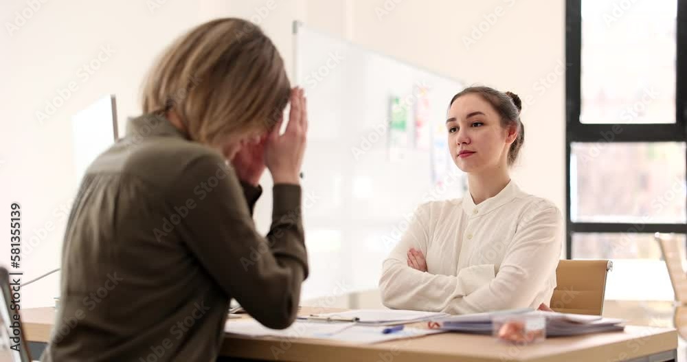 Angry boss woman scolding upset incompetent intern employee at workplace Angry boss woman scolding upset incompetent intern employee at workplace