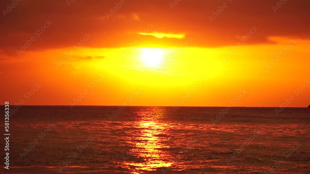 Blurred golden sea at sunset. The sun reflects and sparkles on the waves with bokeh, illuminating the golden sea. Holiday recreation concept. Abstract nautical summer ocean sunset nature background. Blurred golden sea at sunset. The sun reflects and sparkles on the waves with bokeh, illuminating the golden sea. Holiday recreation concept. Abstract nautical summer ocean sunset nature background.