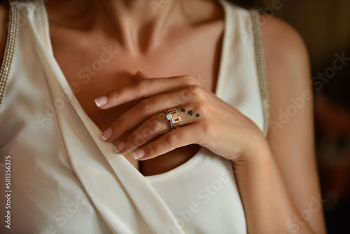 Bride hand wearing a diamond ring. Wedding accessories bride on the wedding day.