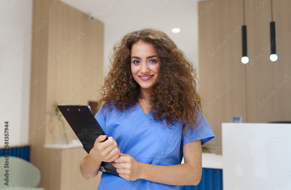 Portrait of dentist nurse posing at reception on private dental clinic. Portrait of dentist nurse posing at reception on private dental clinic.