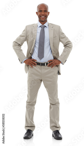 Ive got what it takes. An African-American businessman standing with his hands on his hips.