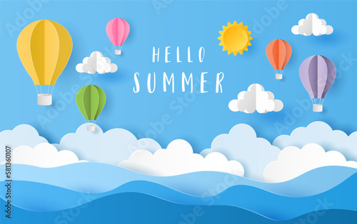 Paper art style of hot air balloons with hello summer text on blue sky. Vector illustration