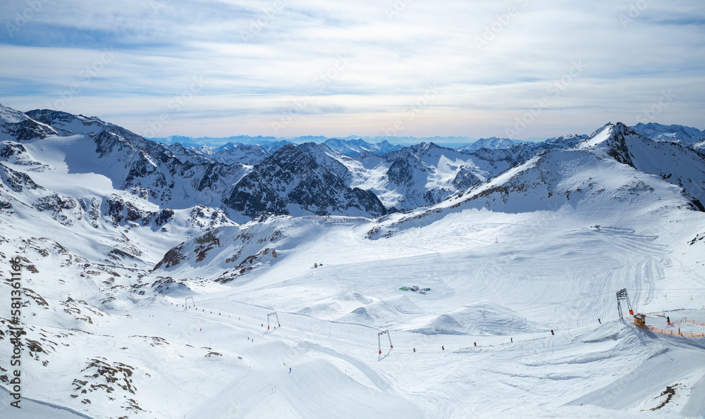Panoramic view of Alps mountain snowy range with skiing trails, Stubai Glacier