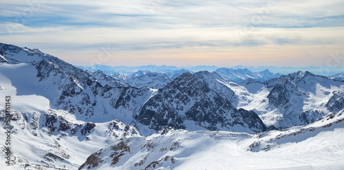 Panoramic view of Alps mountain snowy range with skiing trails, Stubai Glacier