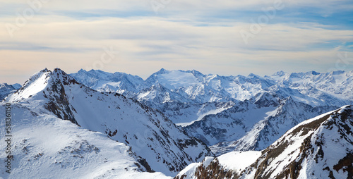 Panoramic view of Alps mountain snowy range with skiing trails  Stubai Glacier