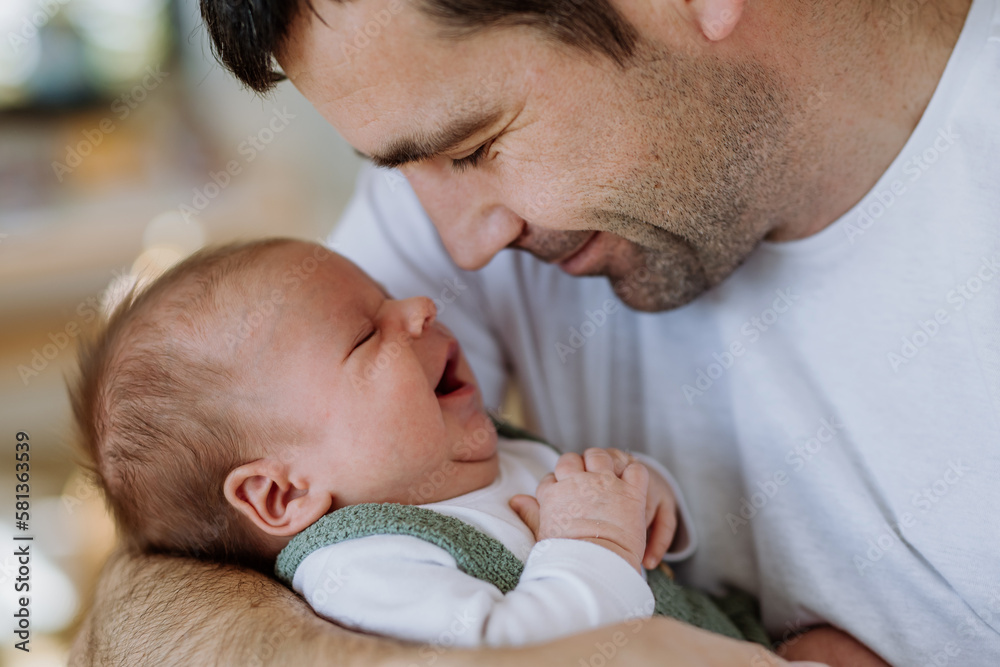 Close-up of father holding his little son. Close-up of father holding his little son.