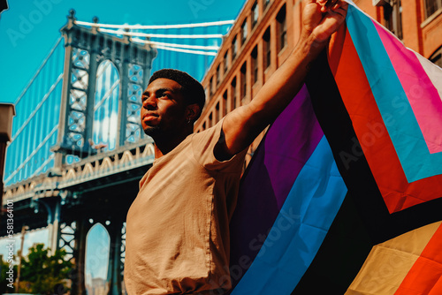 Man holding Pride flag LGTBQIA2S+