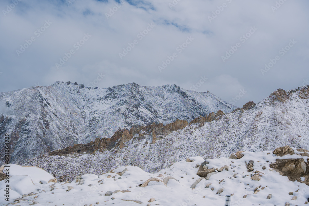 Beautiful view of Khardung La Pass- Leh road on the high mountain covered with snow. It is the highest pass in the world that motorbikes can run through at Ladakh, Leh, India