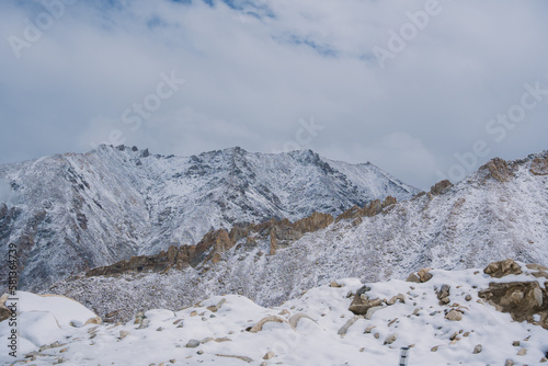 Beautiful view of Khardung La Pass- Leh road on the high mountain covered with snow. It is the highest pass in the world that motorbikes can run through at Ladakh, Leh, India