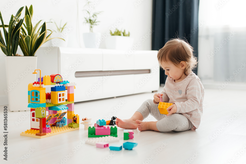 kid girl playing educational toys at kindergarten or nursery room kid girl playing educational toys at kindergarten or nursery room