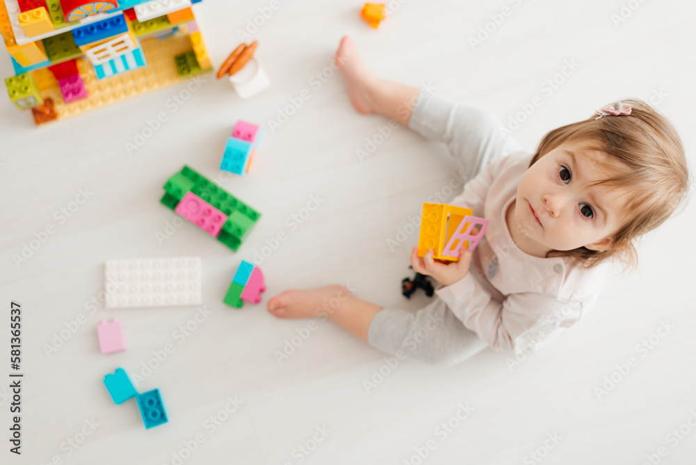 kid girl playing educational toys at kindergarten or nursery room kid girl playing educational toys at kindergarten or nursery room