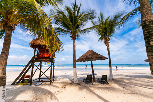 Tropical paradise beach with white sand and coco palms travel tourism wide panorama background. Luxury vacation and holiday, tropical beach resort concept. Beautiful beach design in cancun, mexico © Birol