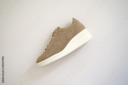 Sneakers woman shoes on white background photo