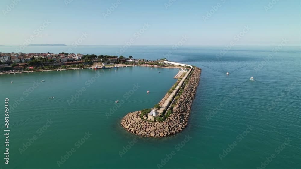 aerial view of the sea and the coast. Aerial view of Gerze harbor on a sunny summer day. Lighthouses and small harbors. Black Sea coast. Aerial shot of a small seaside town. aerial view of the sea and the coast. Aerial view of Gerze harbor on a sunny summer day. Lighthouses and small harbors. Black Sea coast. Aerial shot of a small seaside town.
