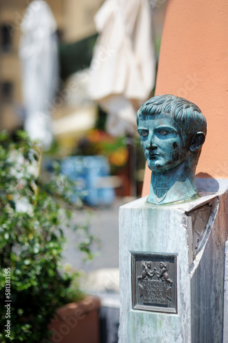 The Bronze herm depicting Caligula, Roman emperor, in Old town of Nemi. Nemi, Lazio, Italy. photo