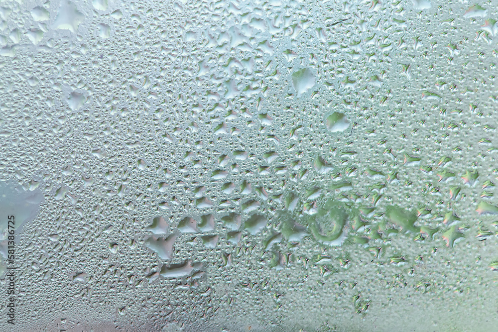 Water drops on a window, textured background, pastel colors, defocused Water drops on a window, textured background, pastel colors, defocused