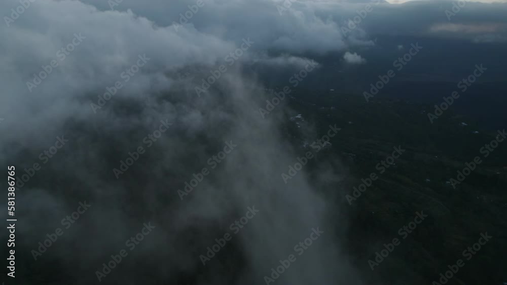 Drone dolley tilt shot through white cirrus clouds above Mount Batur in Bali. Drone dolley tilt shot through white cirrus clouds above Mount Batur in Bali.
