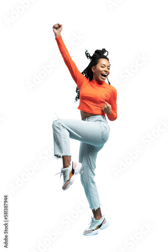 Excited happy pretty girl in casual jeans clothes high jump with raised hands and legs, on transparent background photo
