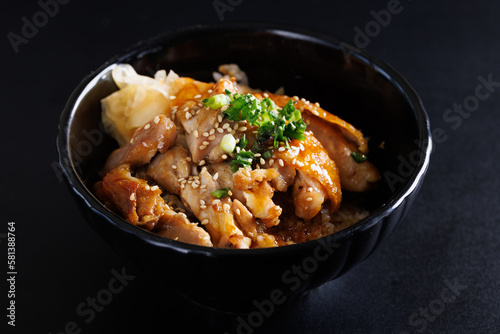 Grilled Chicken teriyaki rice Japanese food isolated in black background