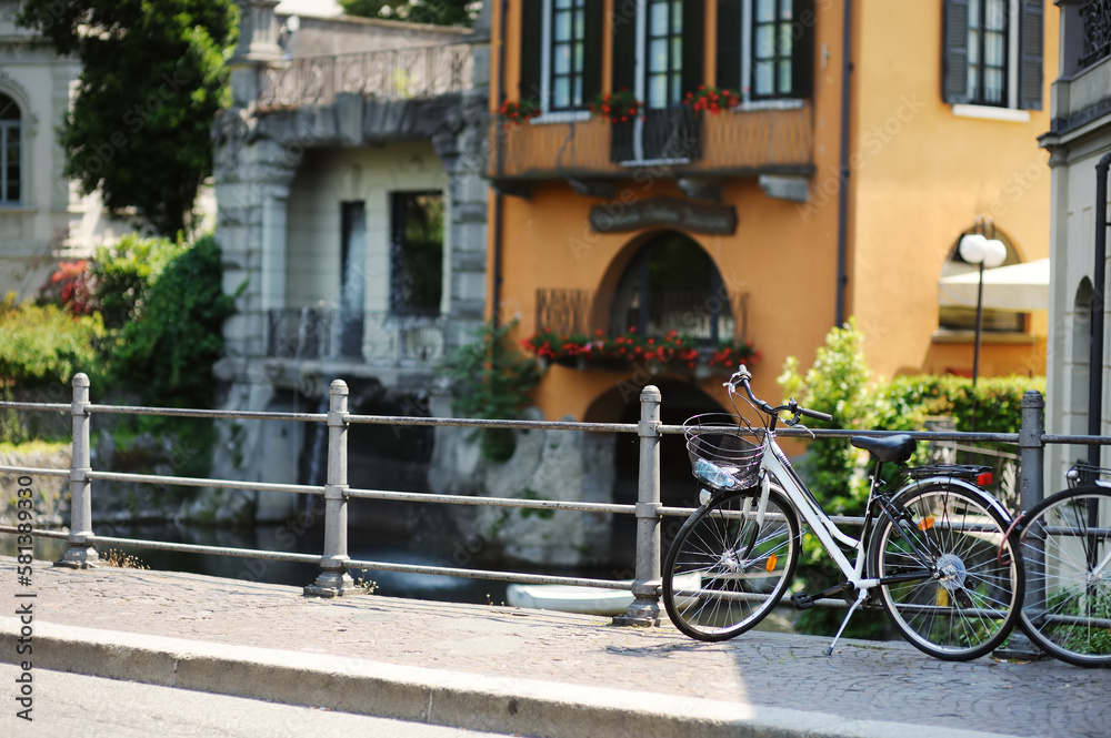Bicycle parked on old cobblestone street in Como town, Lake Como, Italy, Europe