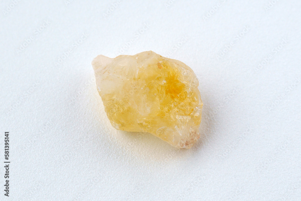 Crystal of Citrine yellow quartz mineral gem stone. White background Crystal of Citrine yellow quartz mineral gem stone. White background