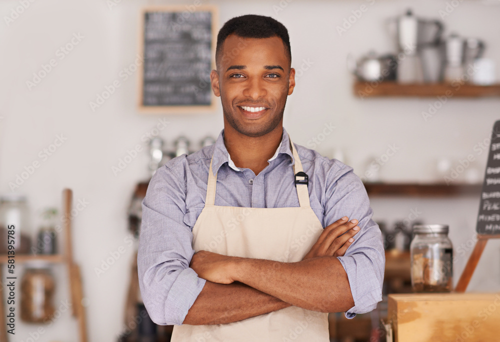 Obraz premium Im the head barista here. Portrait of a successful young barista working in a coffee shop.