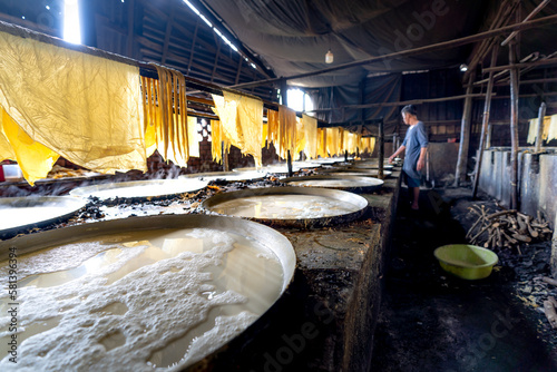 The stage of testing the precipitation of tofu at the tofu factory in My Hoa commune, Vinh Long province, Vietnam photo