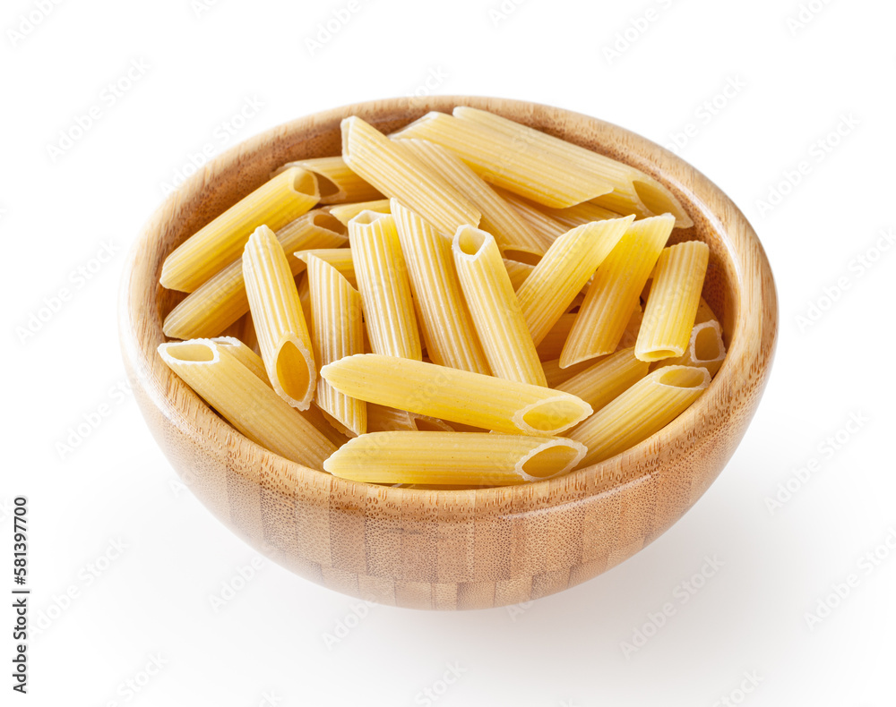 Uncooked penne pasta in wooden bowl isolated on white background with clipping path
